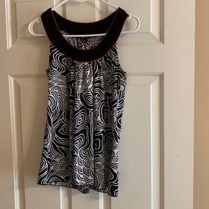 BCX medium sleeveless top. Black and white with red trim. Machine washable.